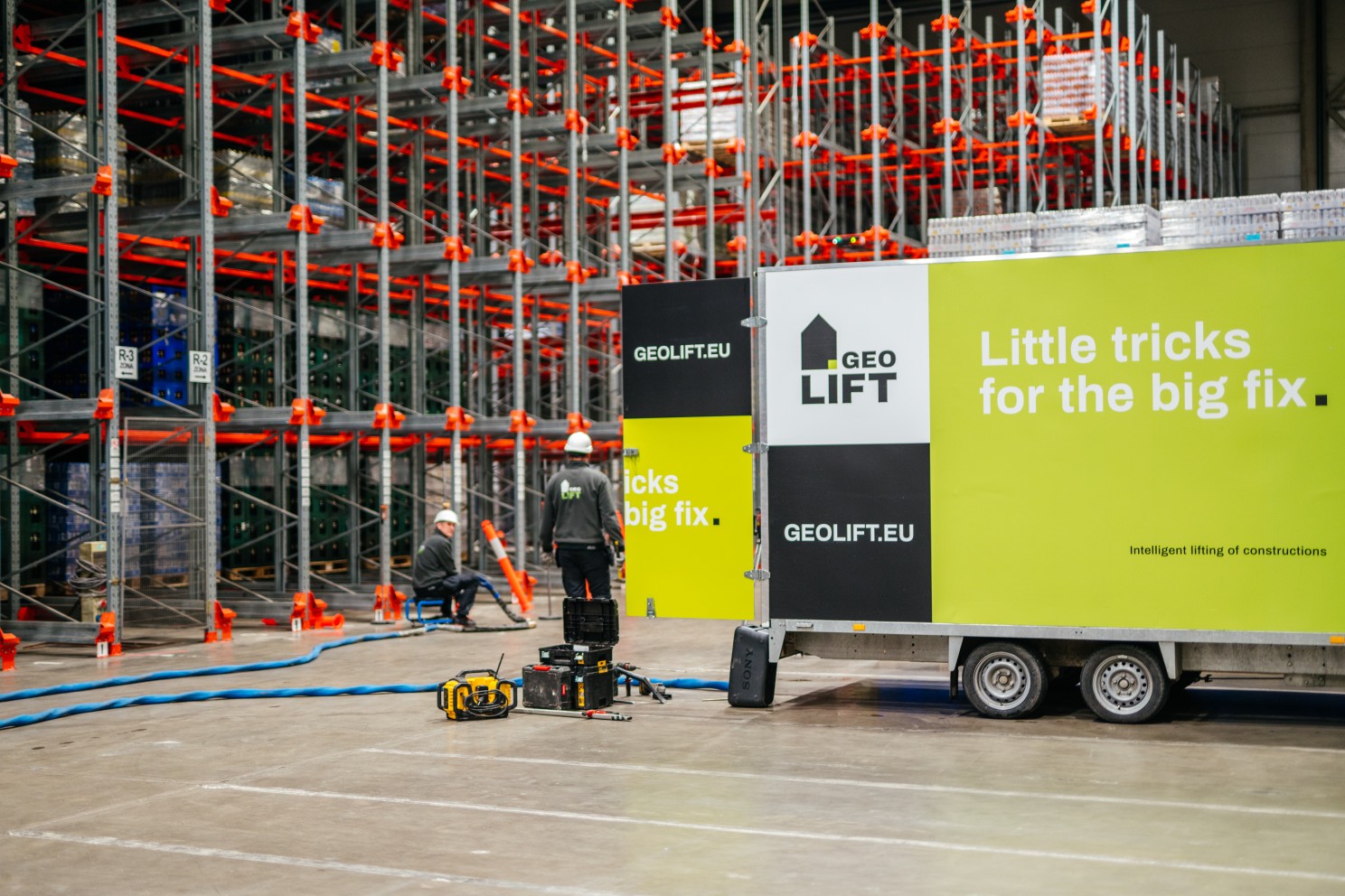 GEOLIFT technicians stabilizing a warehouse concrete floor with geopolymer injection