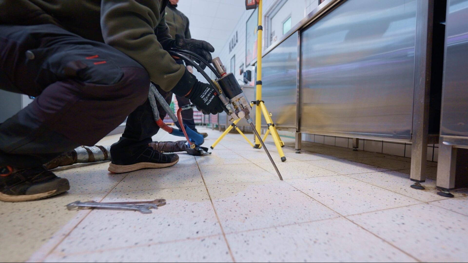 GEOLIFT geopolymer injection under concrete floor near industrial equipment